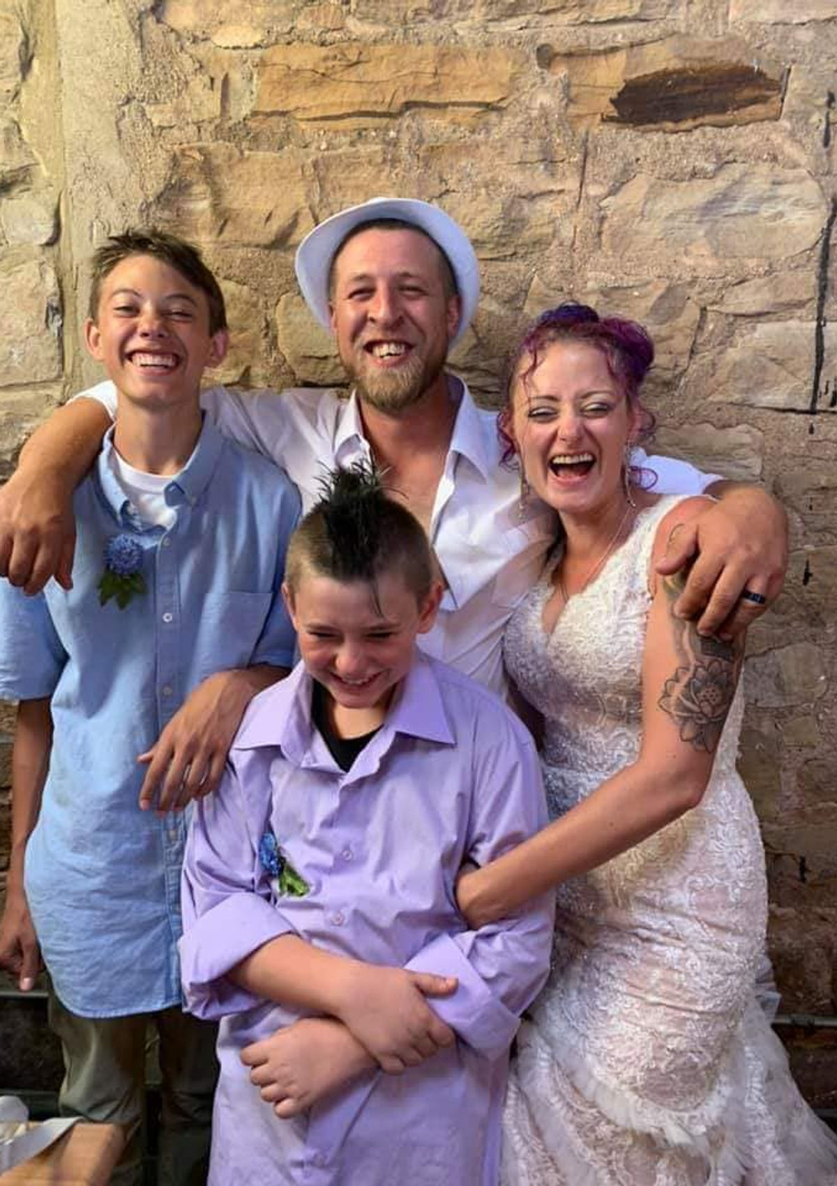 Leif, Nicole, and their two boys together, laughing